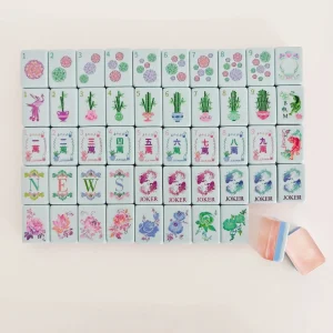 Flat full set display of Pearl Pink Fortune Koi Mahjong Tiles, including suits, winds, koi jokers and flower tiles.