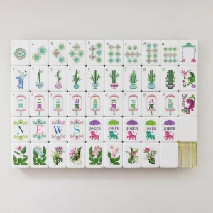 Flat lay of complete Paradise Petal Mahjong Tiles set, including dots, bamboo, wan, wind, floral honor tiles, lion joker tiles and spare blank tiles.