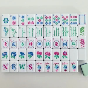Neat flat lay display of luxury Petal Mahjong Tiles showing white, grey, dark green and light cyan 4-layer build.