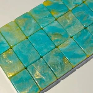 Close-up shot of Phoenix Mahjong Tiles with glossy Quicksand Mint Green marbled gold-glitter tile backs arranged neatly in rows.