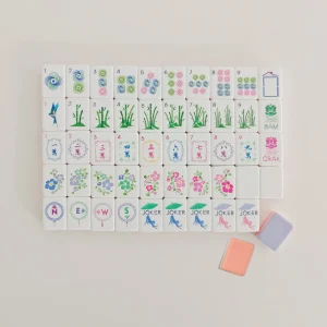 Neatly laid Whimsical Breeze Mahjong Tiles presenting the complete lineup of exclusive tile motifs