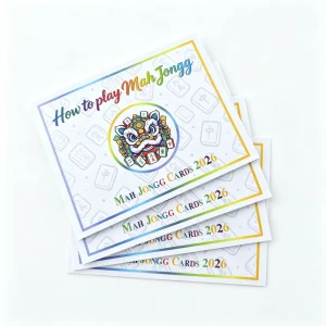 Slanted stacked shot of 2026 mahjong rule cards with lion illustration